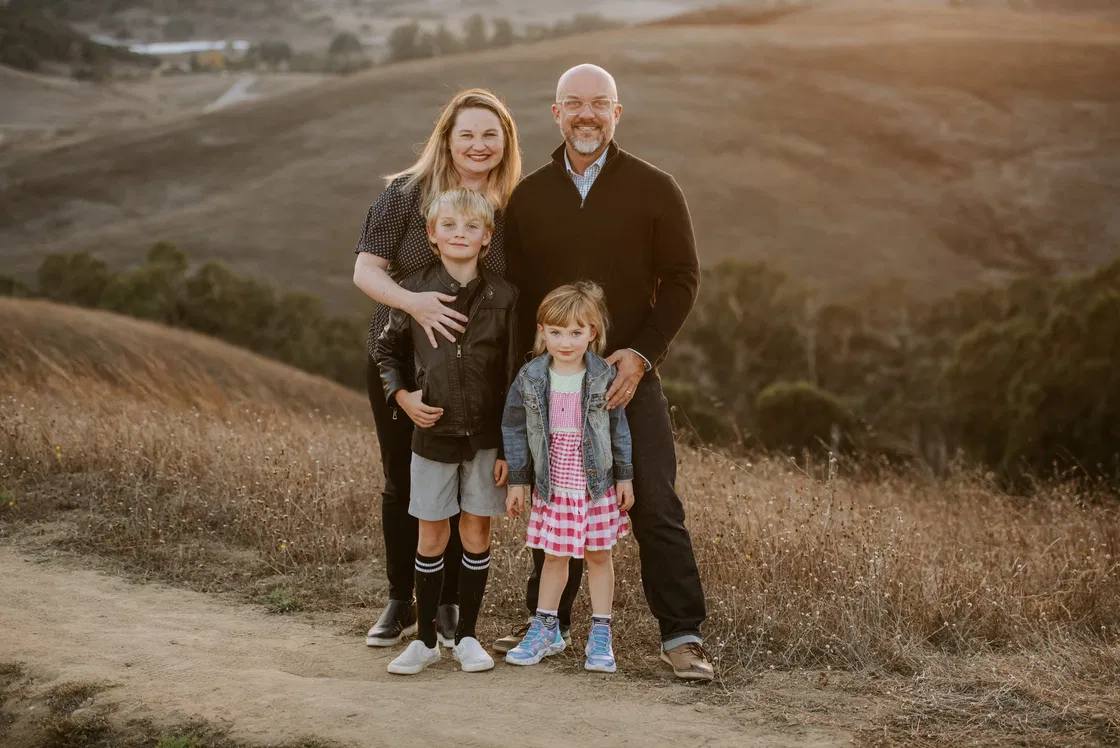 Dave, Jessie, and their two children on a hillside trail above Petaluma, CA, at sunset.